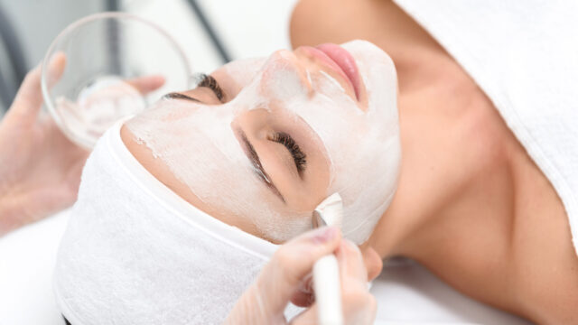 Relaxed young woman enjoying spa procedure